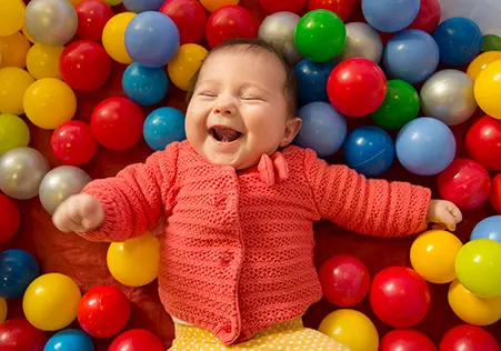 Infant in ball pit