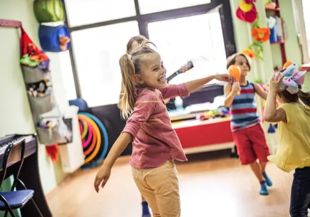 Preschool aged children dancing to music